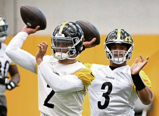 Steelers quarterbacks Justin Fields and Russell Wilson work during practice Oct. 16, 2024 at UPMC Rooney Sports Performance Complex.