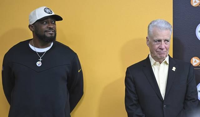 Steelers head coach Mike Tomlin and president Art Rooney II look on as first round pick Troy Fautanu speaks to the media Friday, April 26, 2024 at UPMC Rooney Sports Performance Complex.