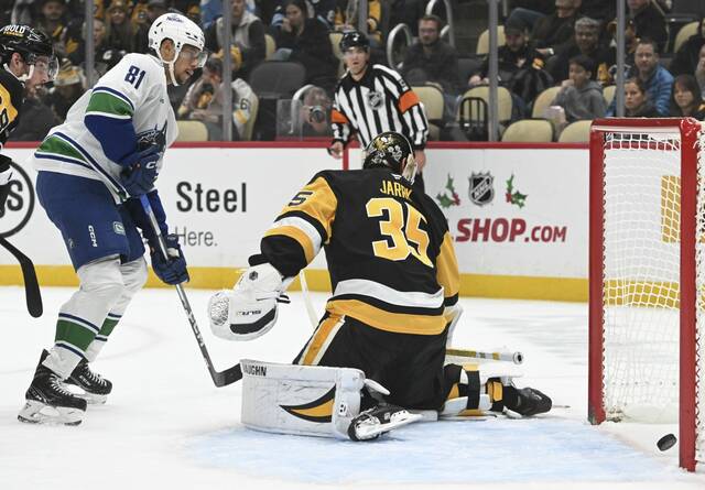 Vancouver Canucks forward Pius Suter’ beats Penguins goaltender Tristan Jarry on Nov. 27, 2024 at PPG Paints Arena.