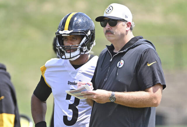 Steelers offensive coordinator Arthur Smith with quarterback Russell Wilson during practice Aug. 14, 2024, at Saint Vincent College.