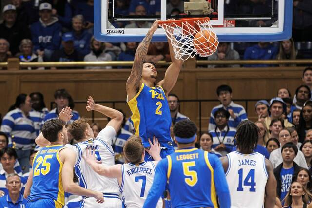 Pitt’s Cameron Corhen (2) dunks during the second half of an NCAA college basketball game against Duke in Durham, N.C., Tuesday, Jan. 7, 2025.