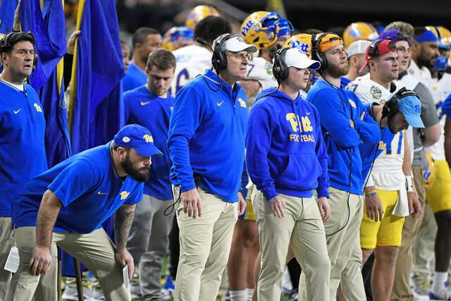 Pitt football coach Pat Narduzzi, center, watches the first half of the GameAbove Sports Bowl against Toledo, Dec. 26, 2024, in Detroit.