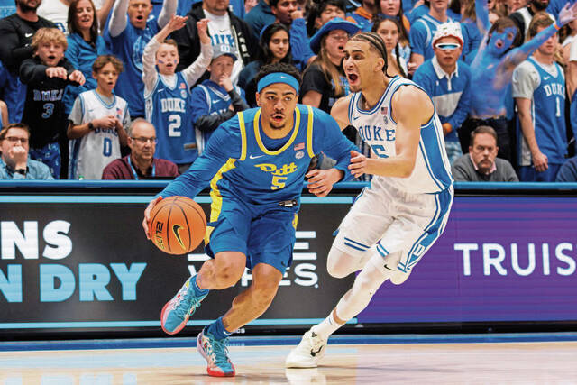 Pitt’s Ishmael Leggett, left, drives against Duke’s Tyrese Proctor during the first half of an NCAA college basketball game in Durham, N.C., Tuesday, Jan. 7, 2025.