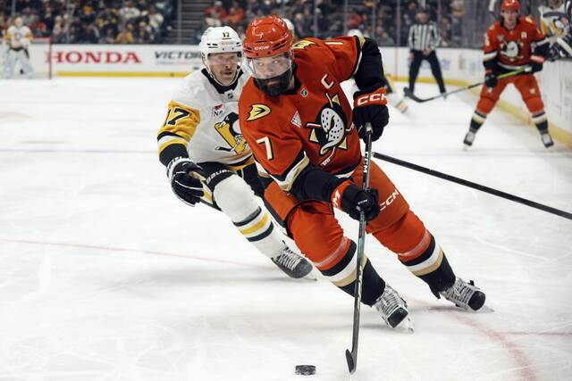 Anaheim Ducks defenseman Radko Gudas, right, controls the puck away from Penguins winger Bryan Rust during the second period Thursday.