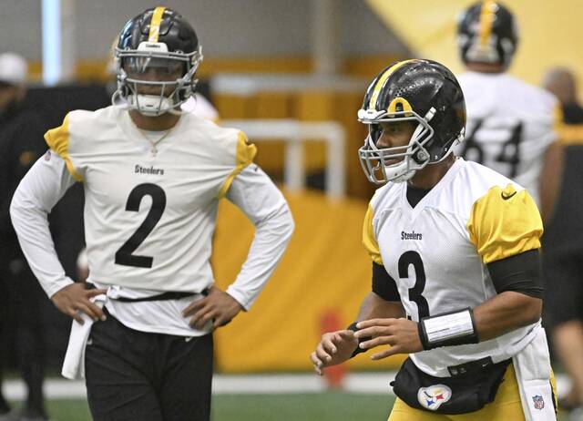 Steelers quarterbacks Russell Wilson and Justin Fields work during practice Oct. 16, 2024 at UPMC Rooney Sports Performance Complex.