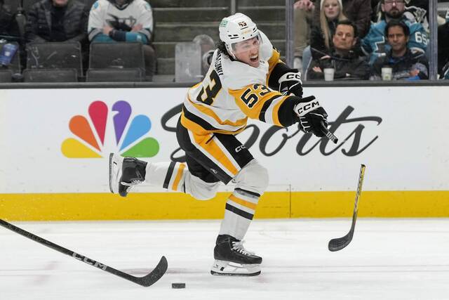 Penguins forward Philip Tomasino breaks his stick while shooting the puck against the San Jose Sharks during the second period Monday.