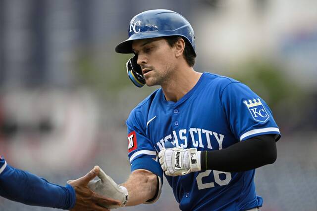 FILE - Kansas City Royals’ Adam Frazier reacts at first base after his single drove in two runs during the ninth inning of a baseball game against the Washington Nationals, Thursday, Sept. 26, 2024, in Washington. (AP Photo/Nick Wass, File)