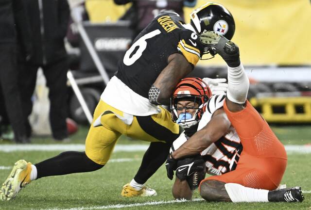 Patrick Queen (left) led the Steelers with 129 tackles.