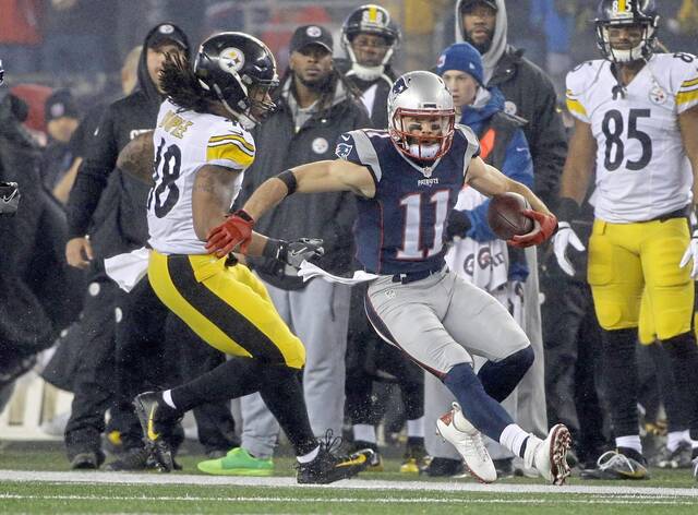 New England Patriots wide receiver Julian Edelman runs against Steelers linebacker Bud Dupree after a reception in the AFC Championship game on Jan. 22, 2017, in Foxborough, Mass.