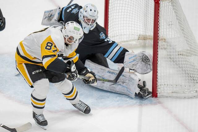 Penguins center Sidney Crosby scores the winning goal in overtime against Utah Hockey Club goaltender Connor Ingram on Wednesday in Salt Lake City.