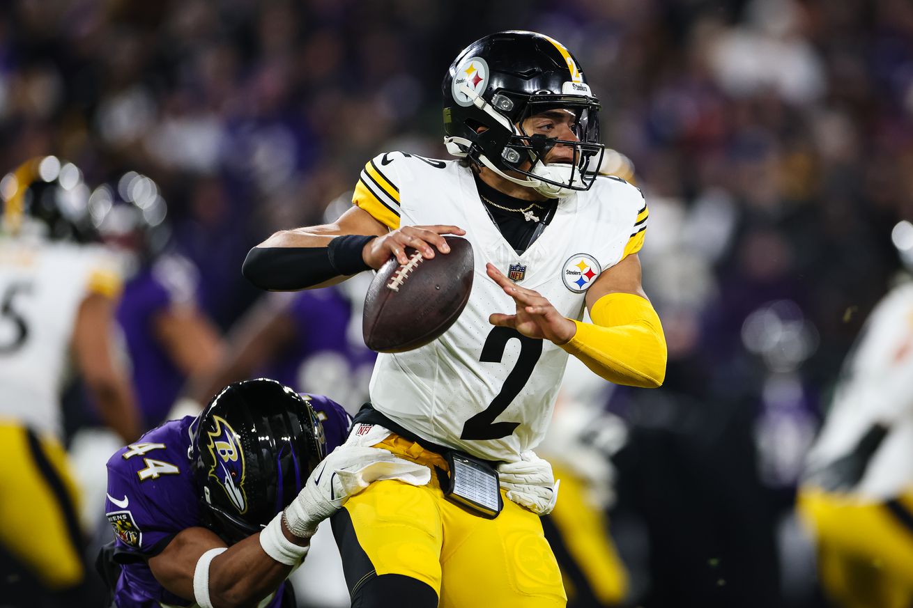 Justin Fields #2 of the Pittsburgh Steelers looks to pass as Marlon Humphrey #44 of the Baltimore Ravens defends during the first half of the AFC Wild Card Playoff game at M&T Bank Stadium on January 11, 2025 in Baltimore, Maryland.