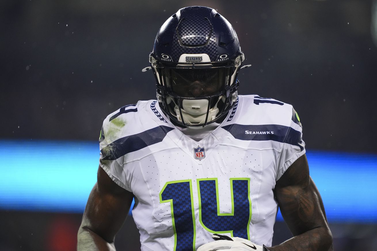 DK Metcalf #14 of the Seattle Seahawks runs across the field during an NFL football game against the Chicago Bears at Soldier Field on December 26, 2024 in Chicago, Illinois.